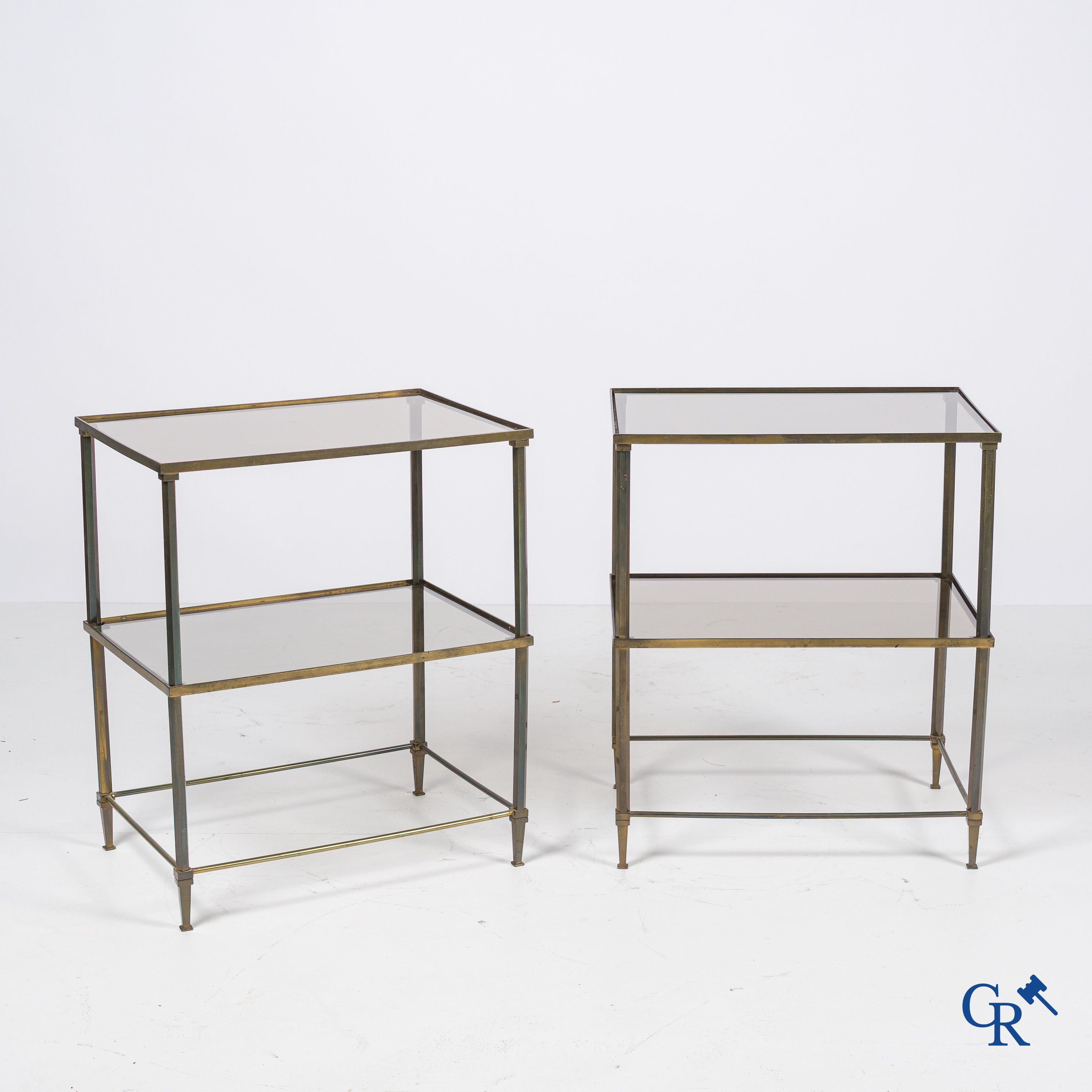 A pair of side tables in bronze and glass. Around 1960.