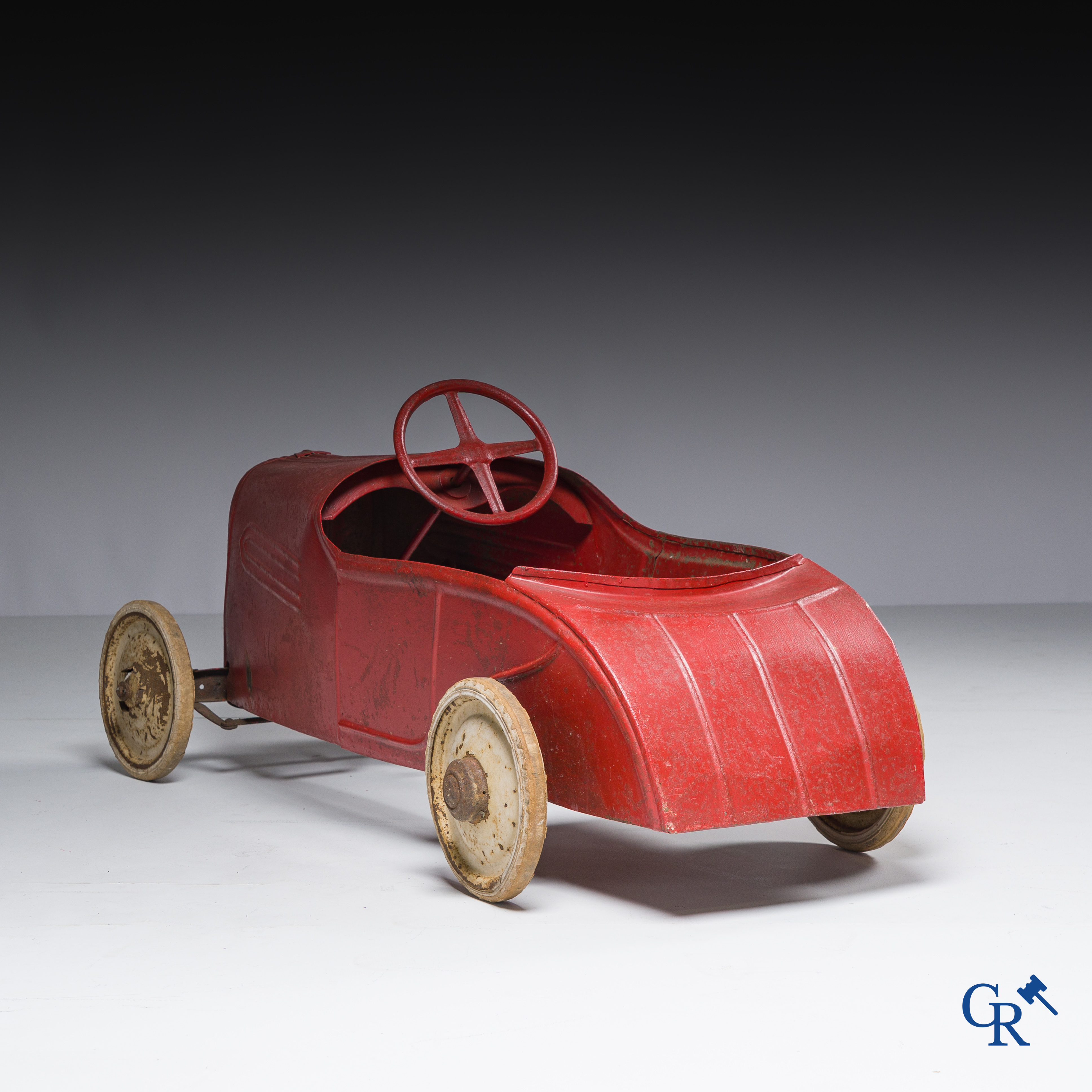 Torck, Deinze. Pedal car with white rubber tires and original emblem. Circa 1936.