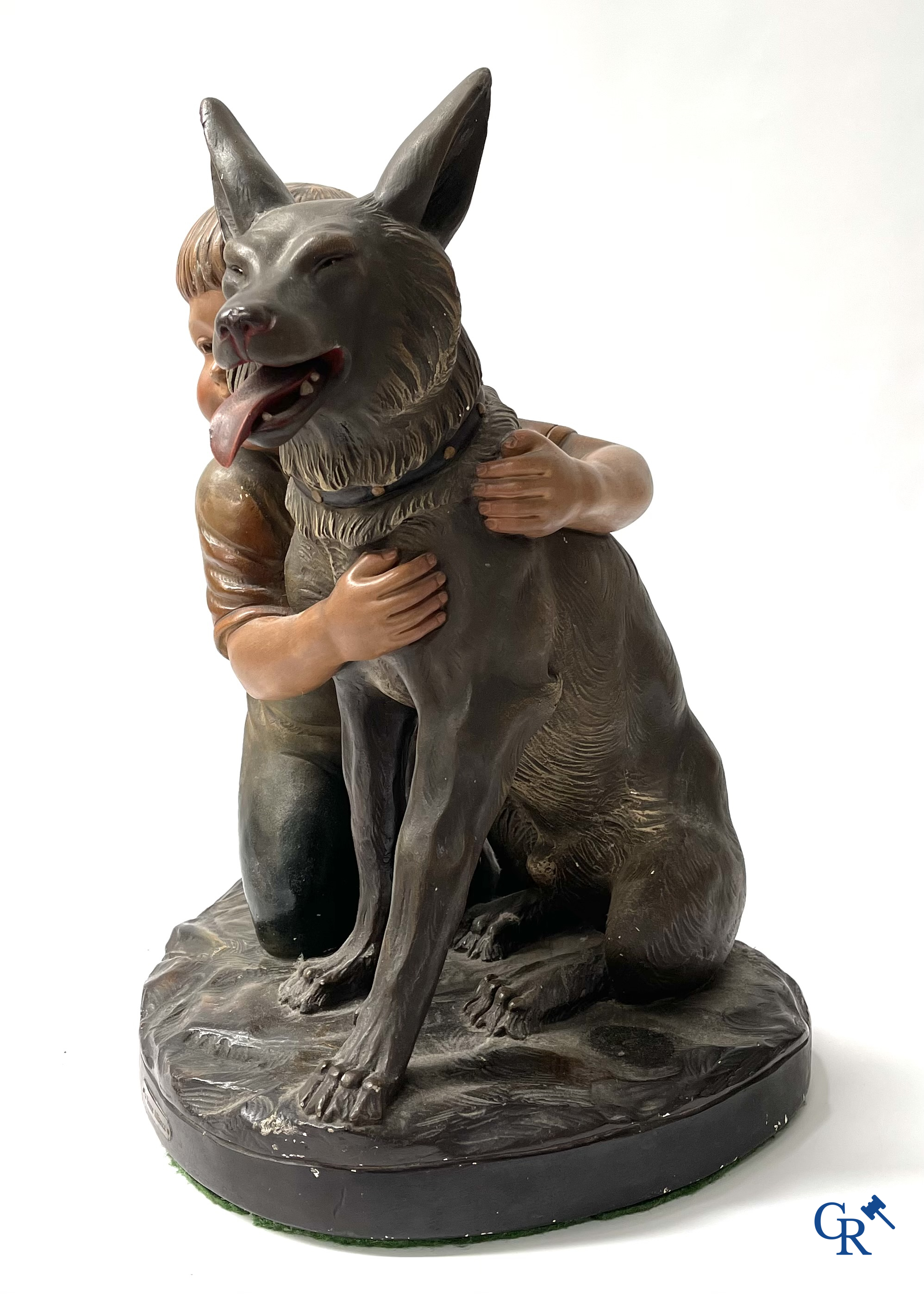 Plaster sculpture, boy with dog and a plaster lamp.