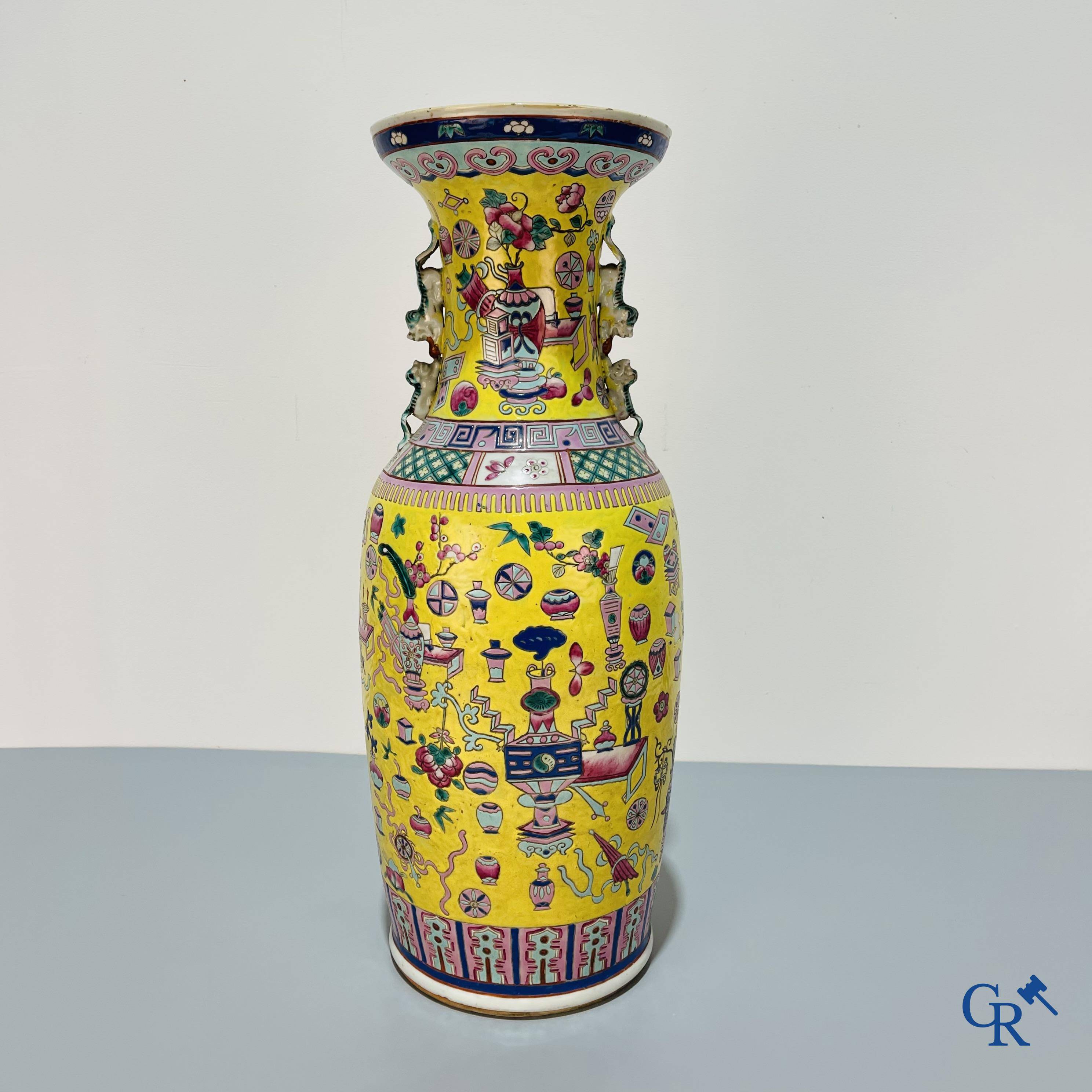 Asian Art, Chinese porcelain, a large Chinese famille jaune and rose vase with a decor of antiques. 19th century.