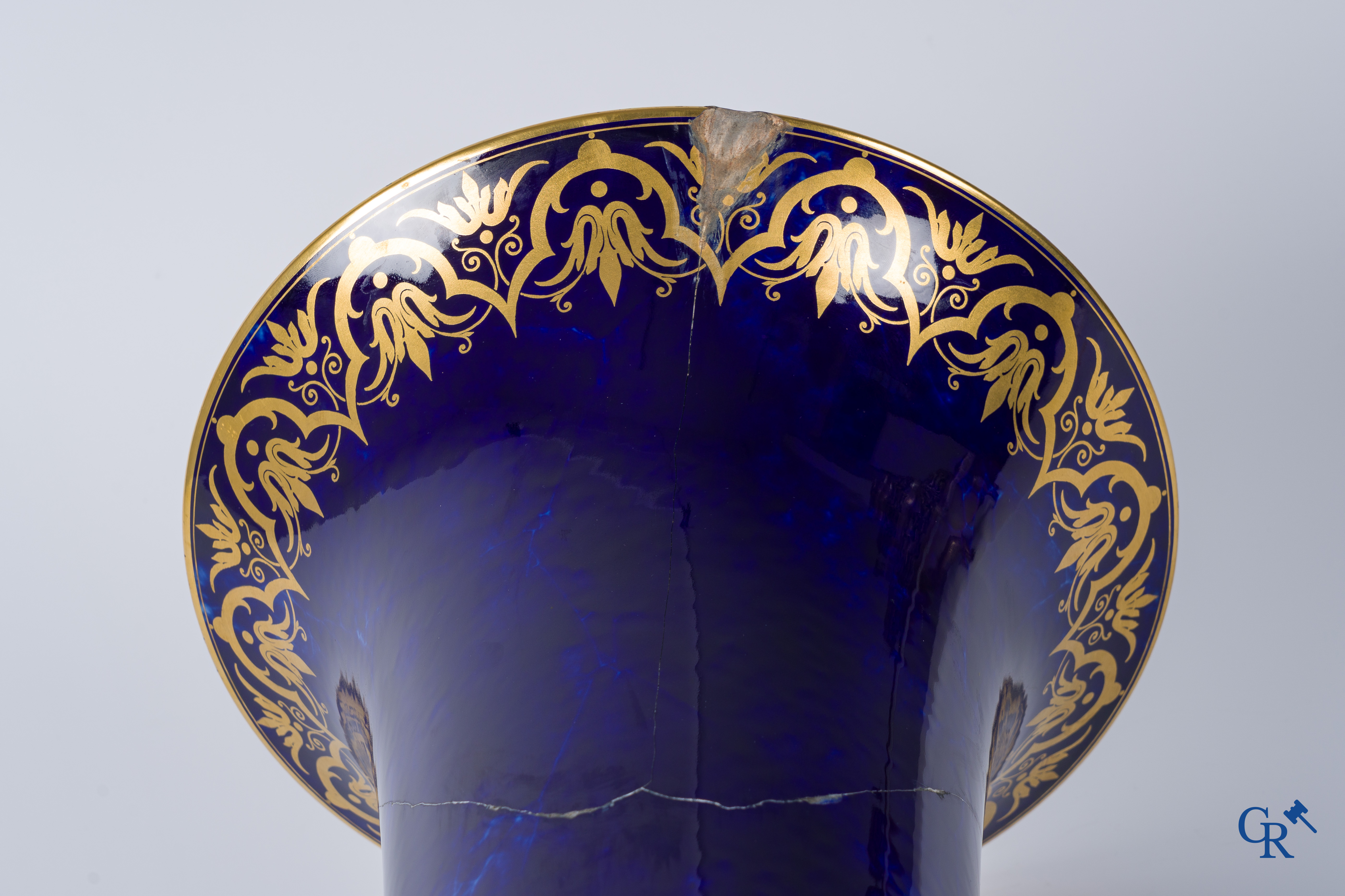 Manufacture Nationale de Sèvres. important vase with a gilded decor on a blue background colour.