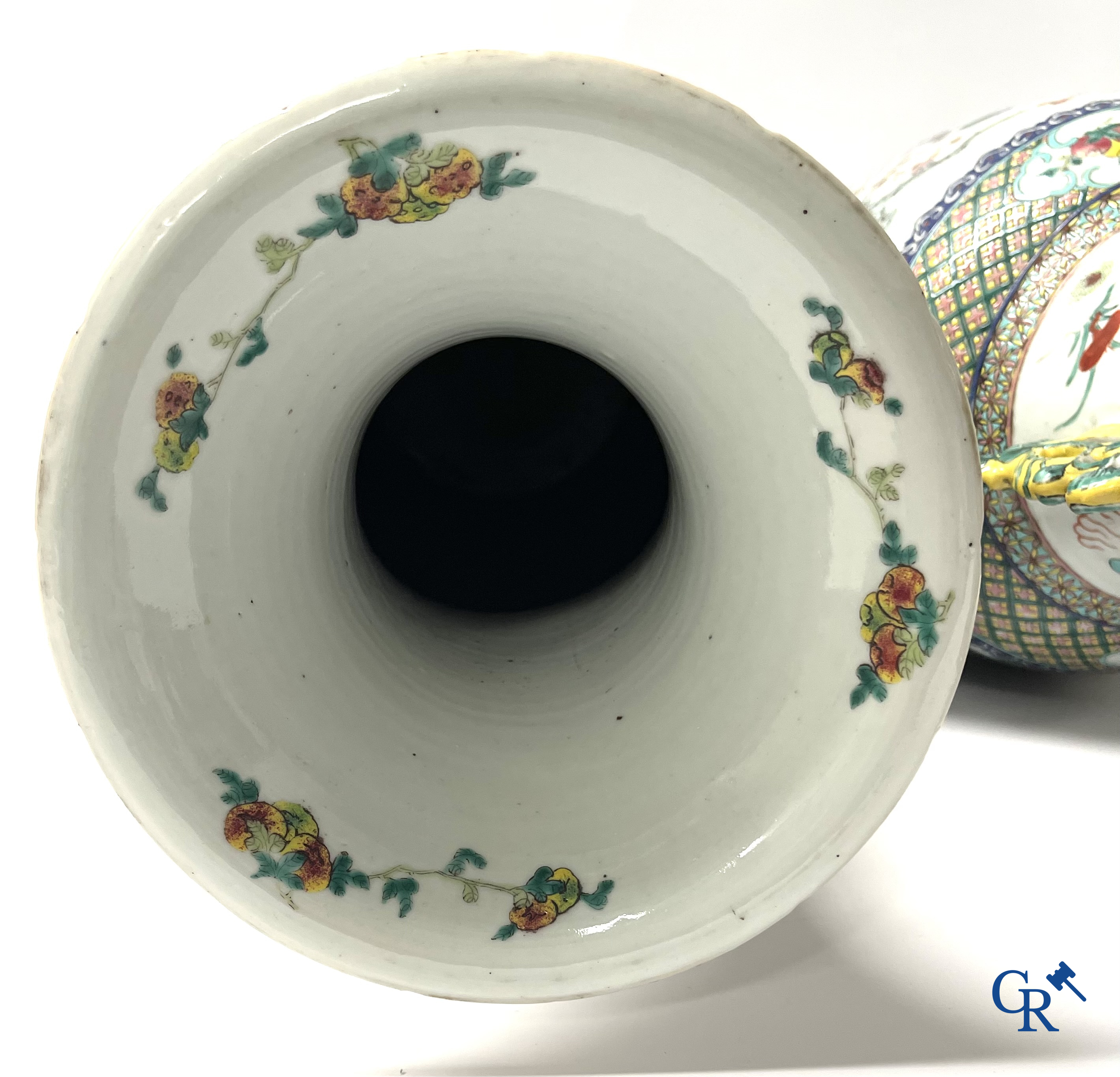 Asian Art, A pair of Chinese famille rose vases with peacocks and Fo dogs. 19th century.