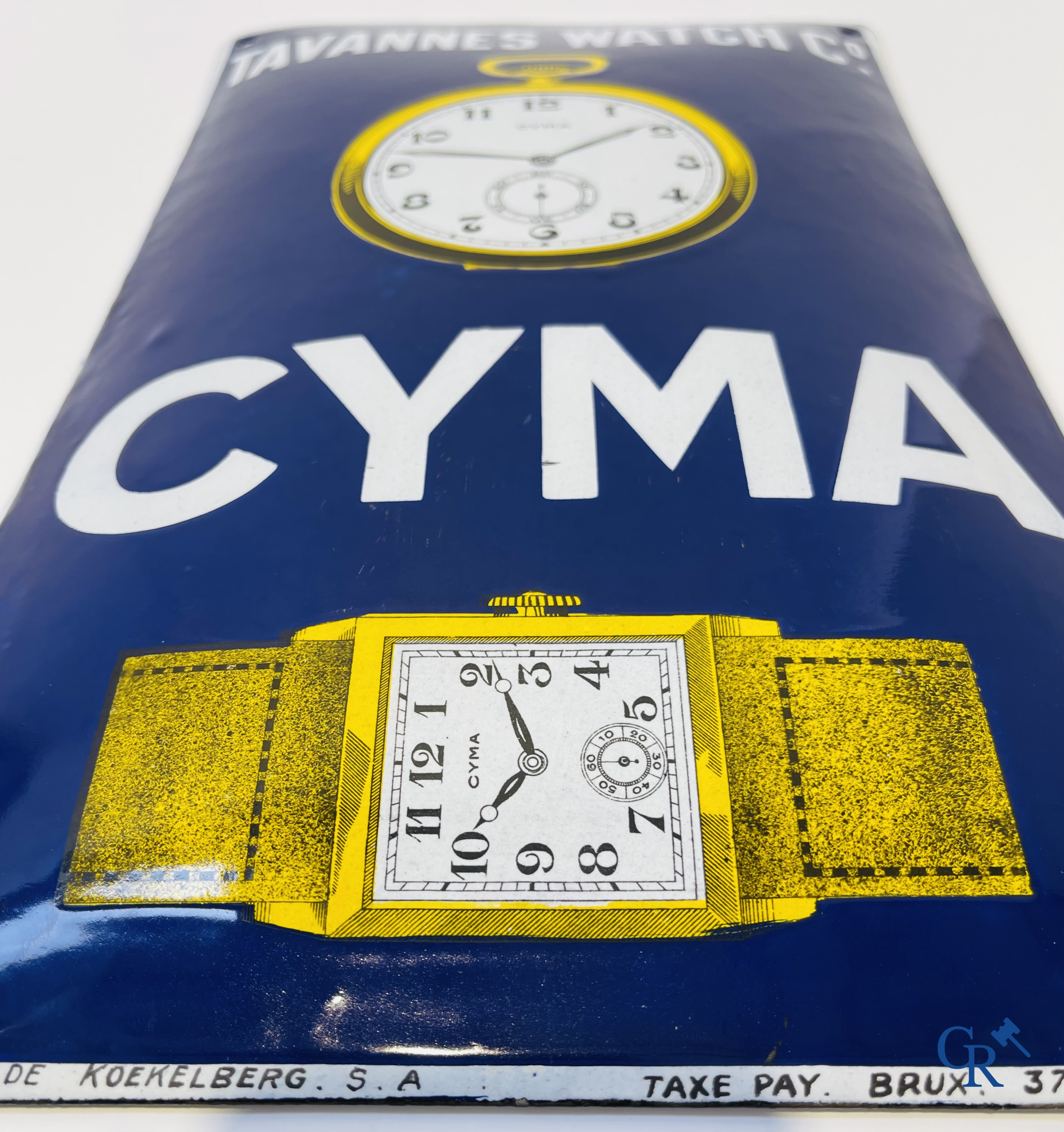 Tavannes Watch Company. Bombed enamel advertising sign for Cyma wrist and pocket watches. 1926.