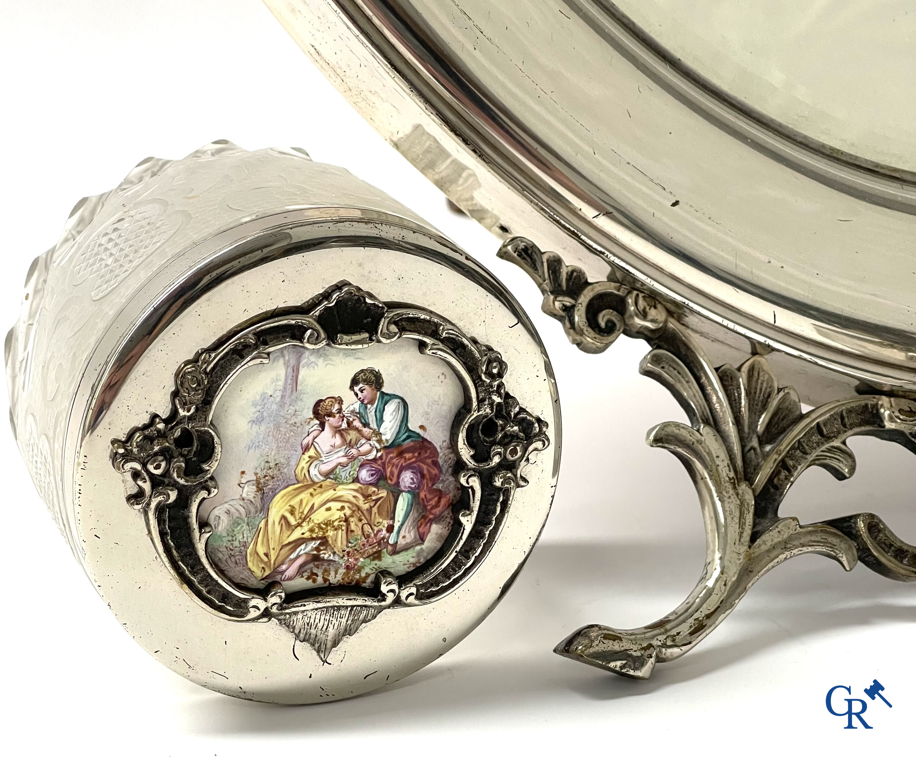 A seven-piece toilet set in silver-plated metal, finely cut crystal and enamelled plaques.