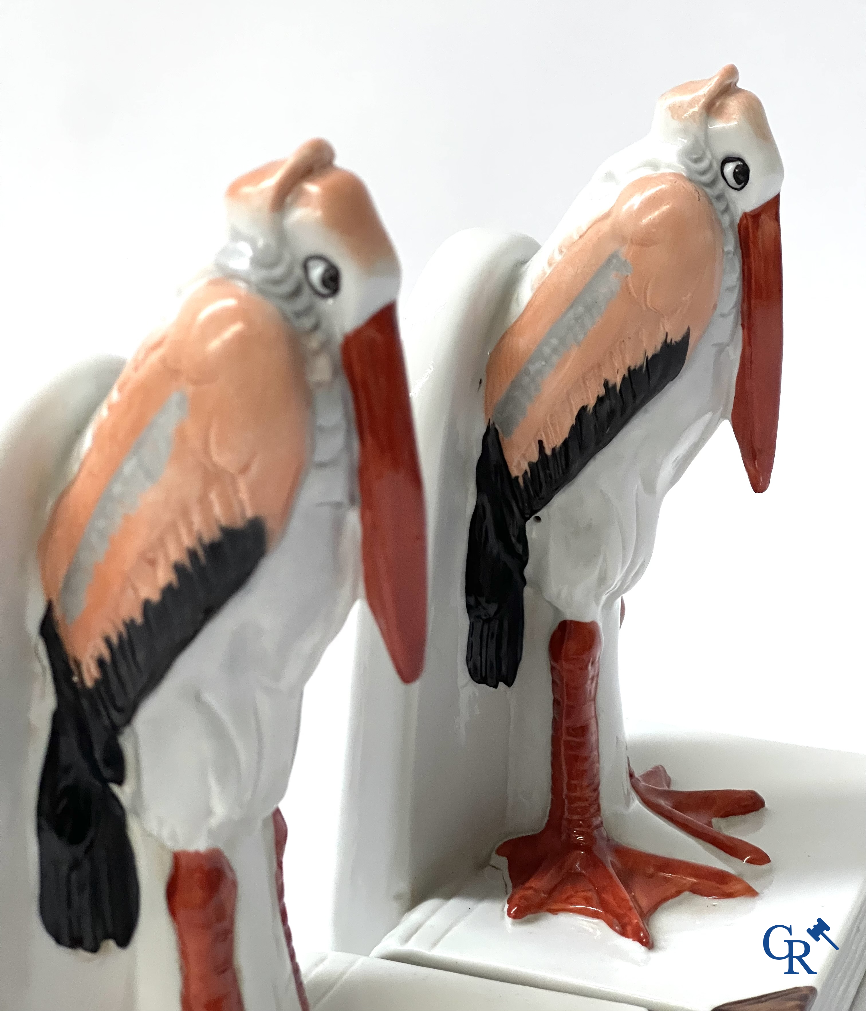 Art Deco, a pair of bookends in polychrome porcelain with a typical Art Deco representation of marabou.