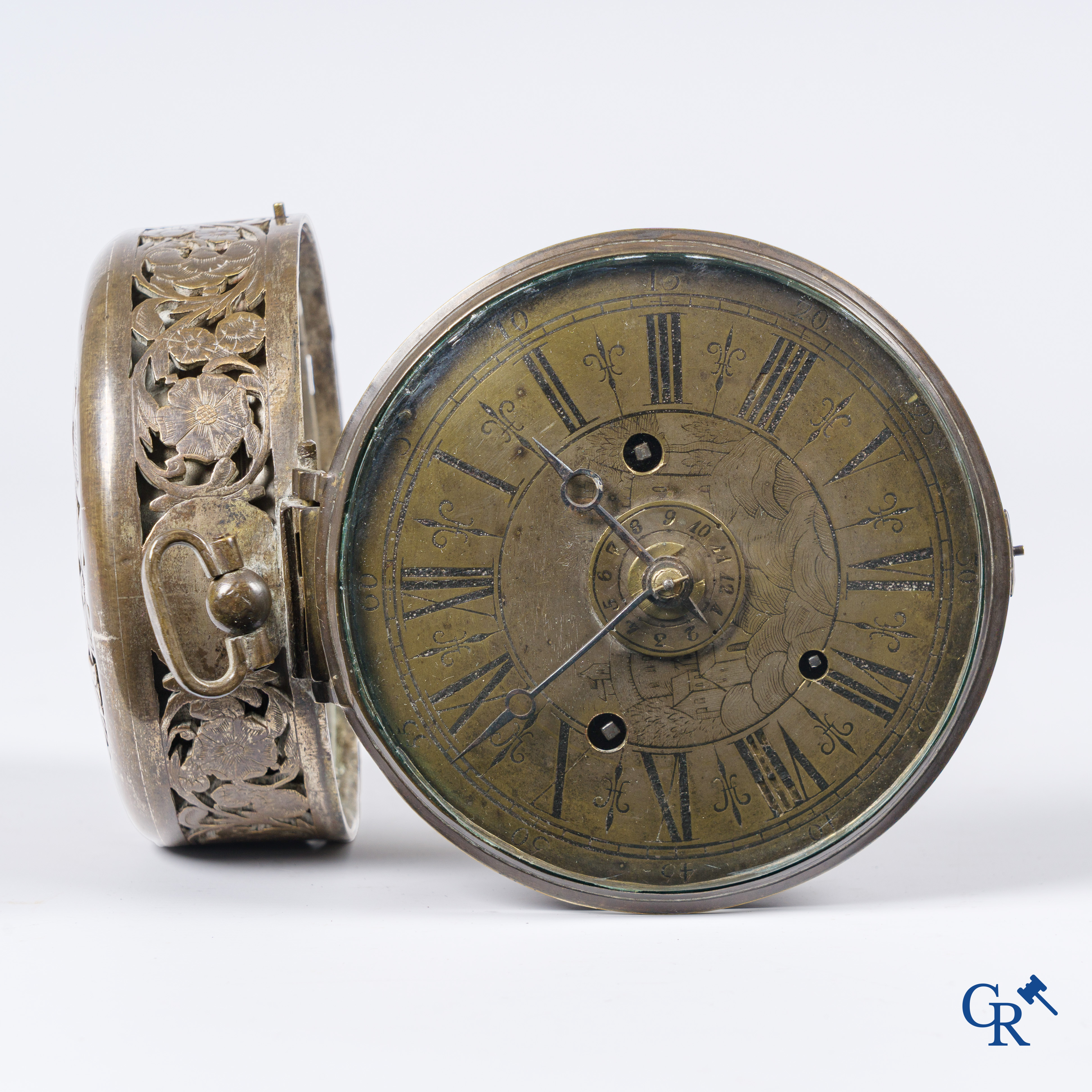 Clocks and watches. Montre de carosse. Large carriage watch with engraved and perforated case. France 17th century.