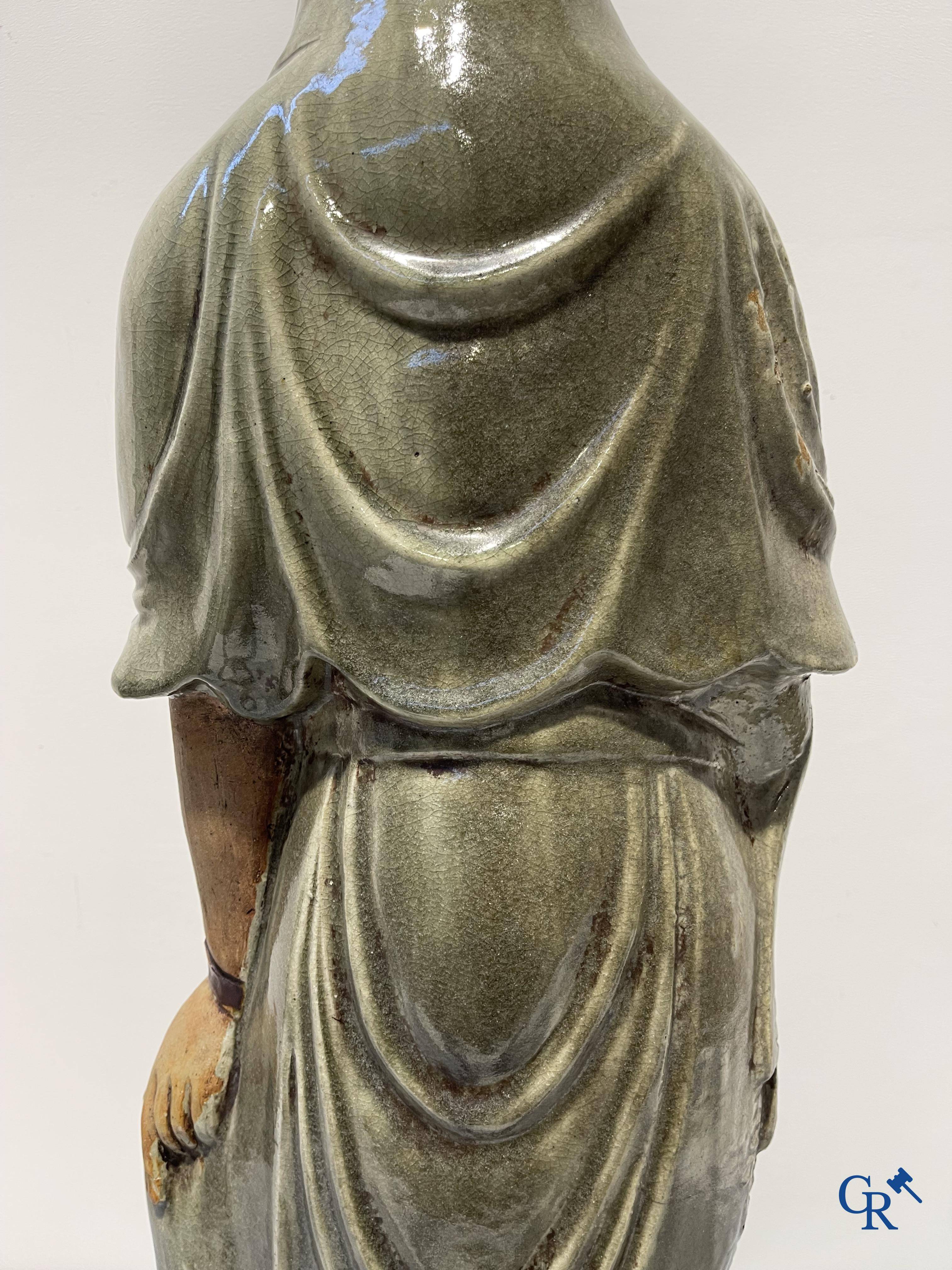Asian Art, an imposing Shiwan earthenware figure of Guanyin.