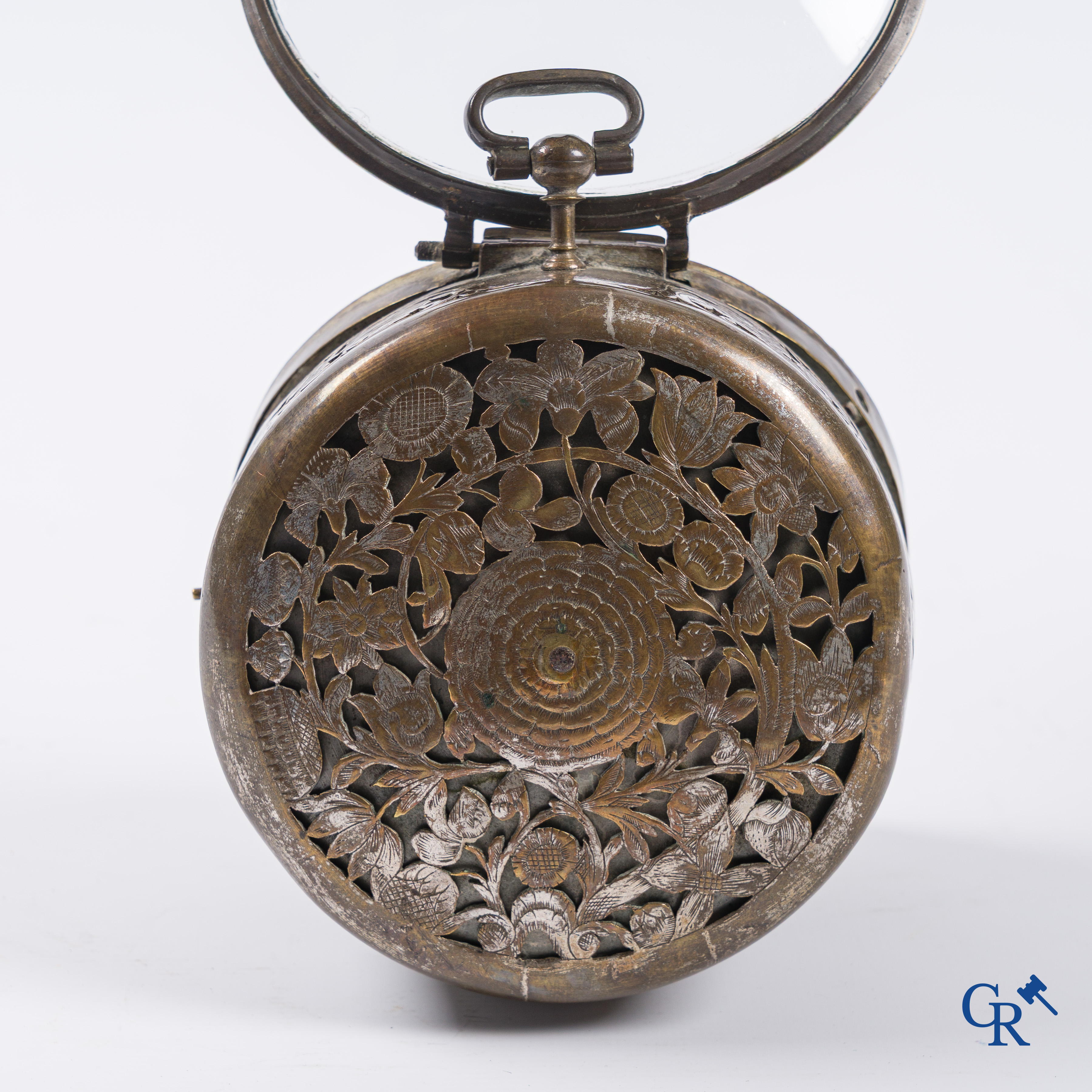 Clocks and watches. Montre de carosse. Large carriage watch with engraved and perforated case. France 17th century.