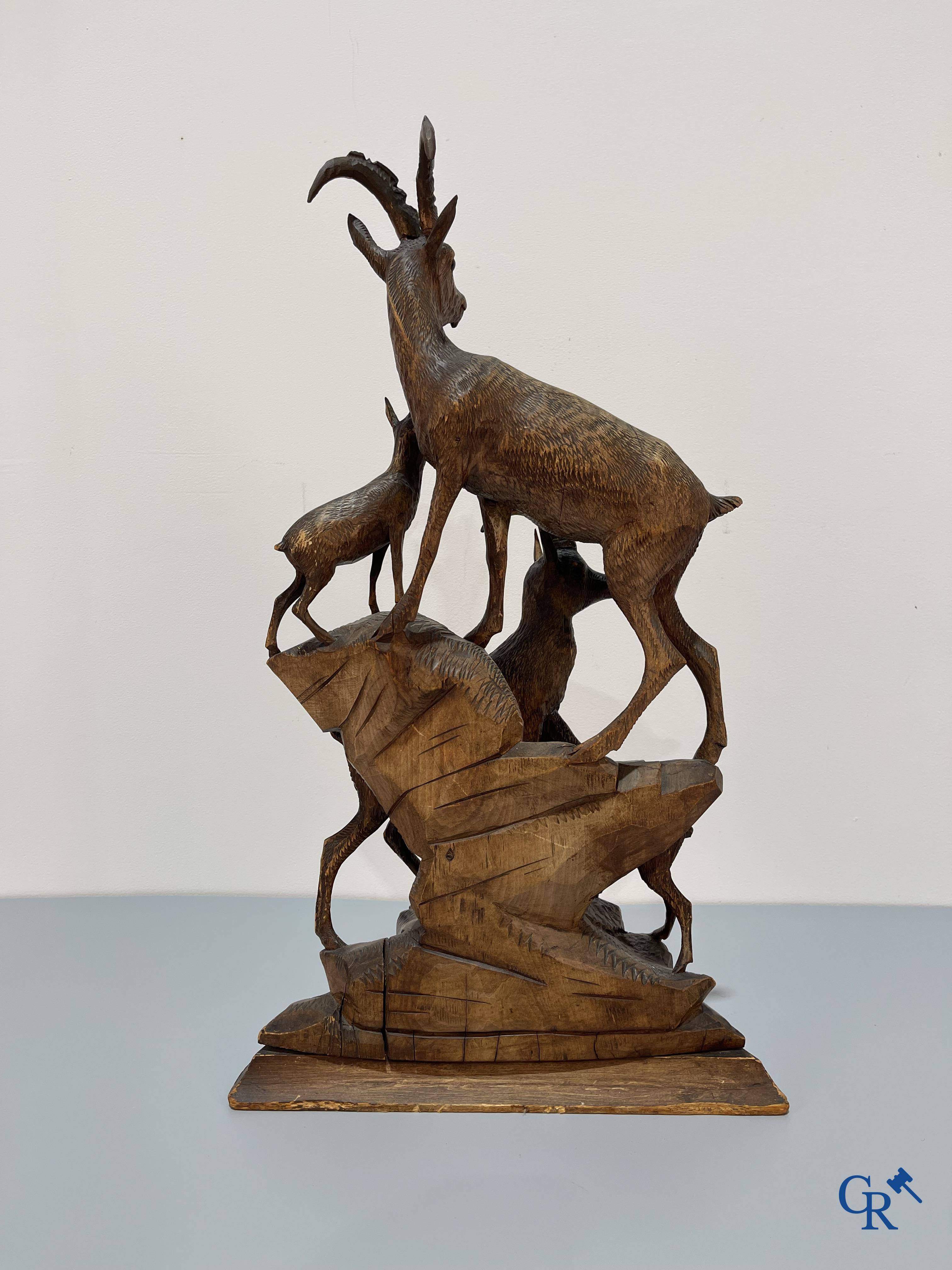 A Black Forest wood sculpture with capricorns, Germany circa 1900.