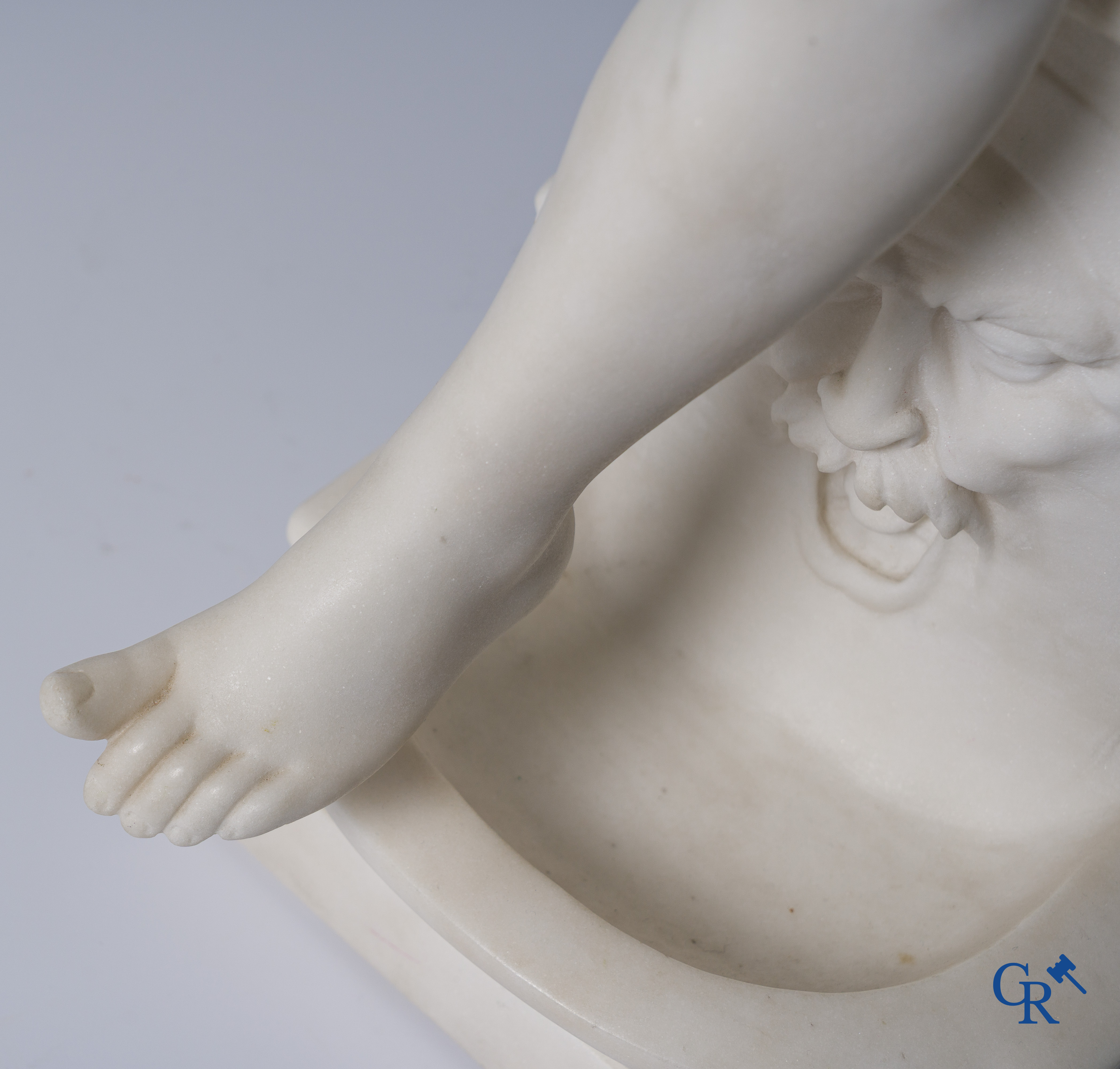 G. Tosi, Beautiful statue in carved marble, seated cupid at wall fountain. Circa 1900.