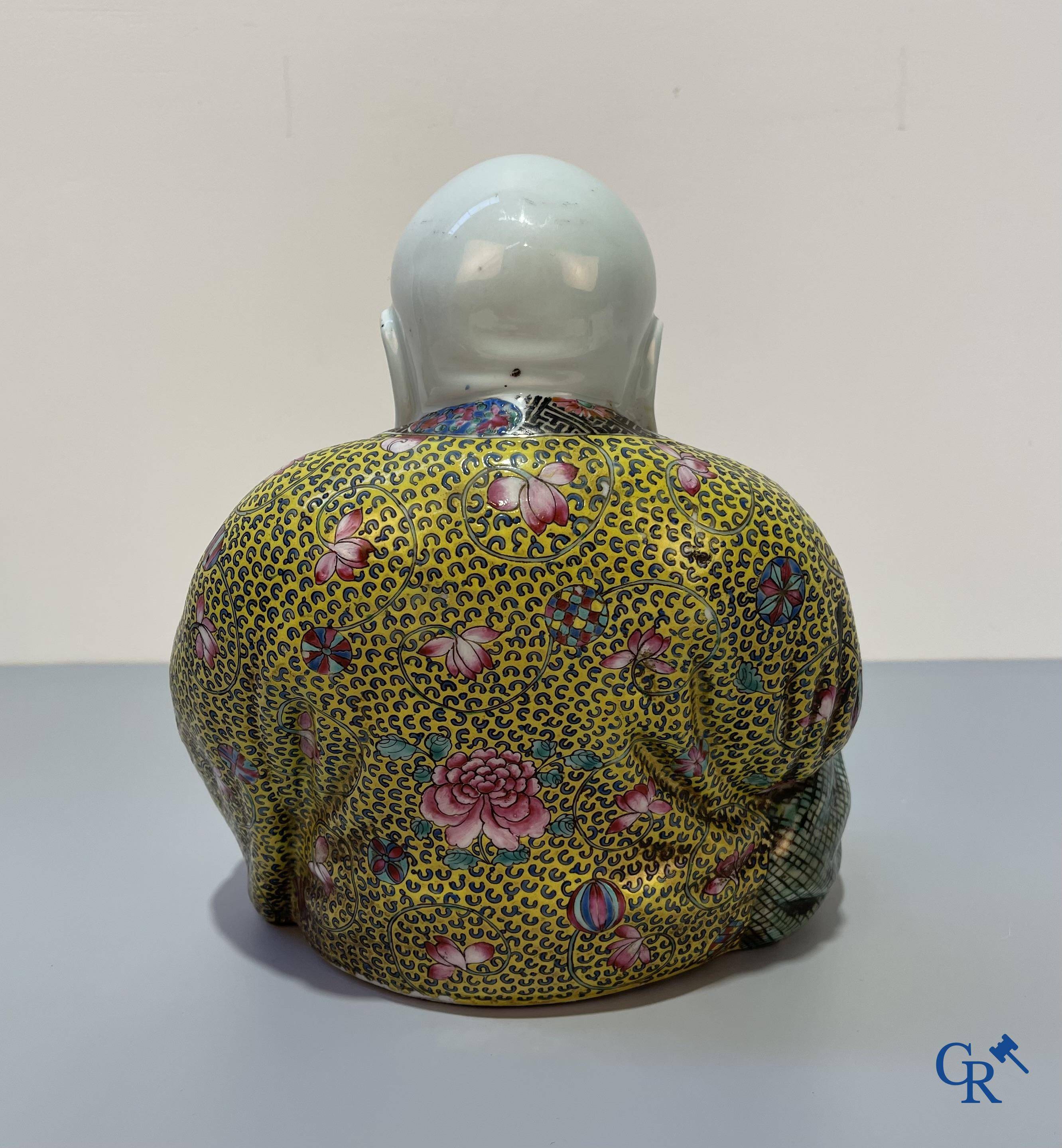 Asian Art, Chinese porcelain. A Chinese famille rose figure of a Buddha with a seal mark. 19th century.