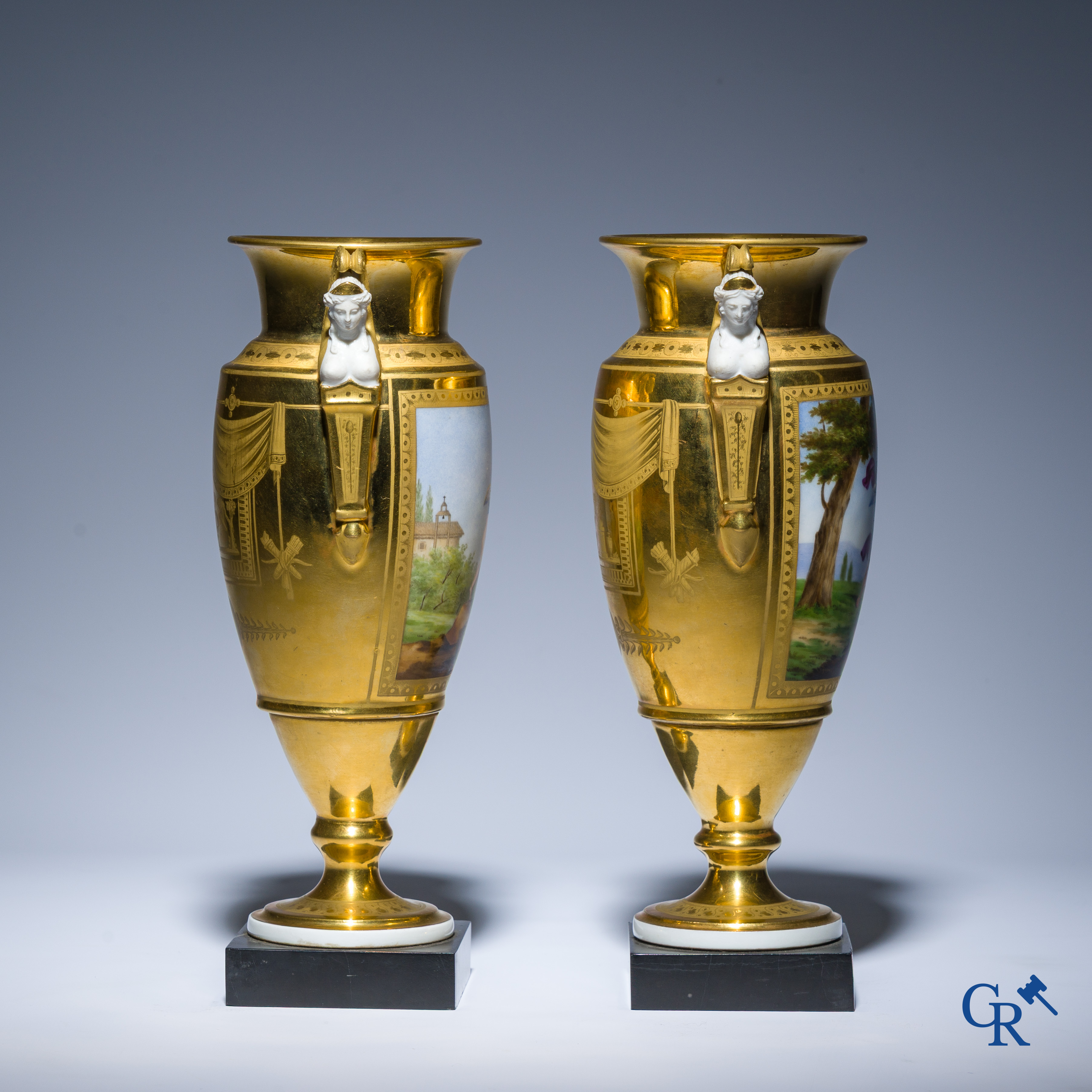 Empire, a pair of finely gilded and decorated vases in porcelain and biscuit on a marble pedestal, Circa 1810.