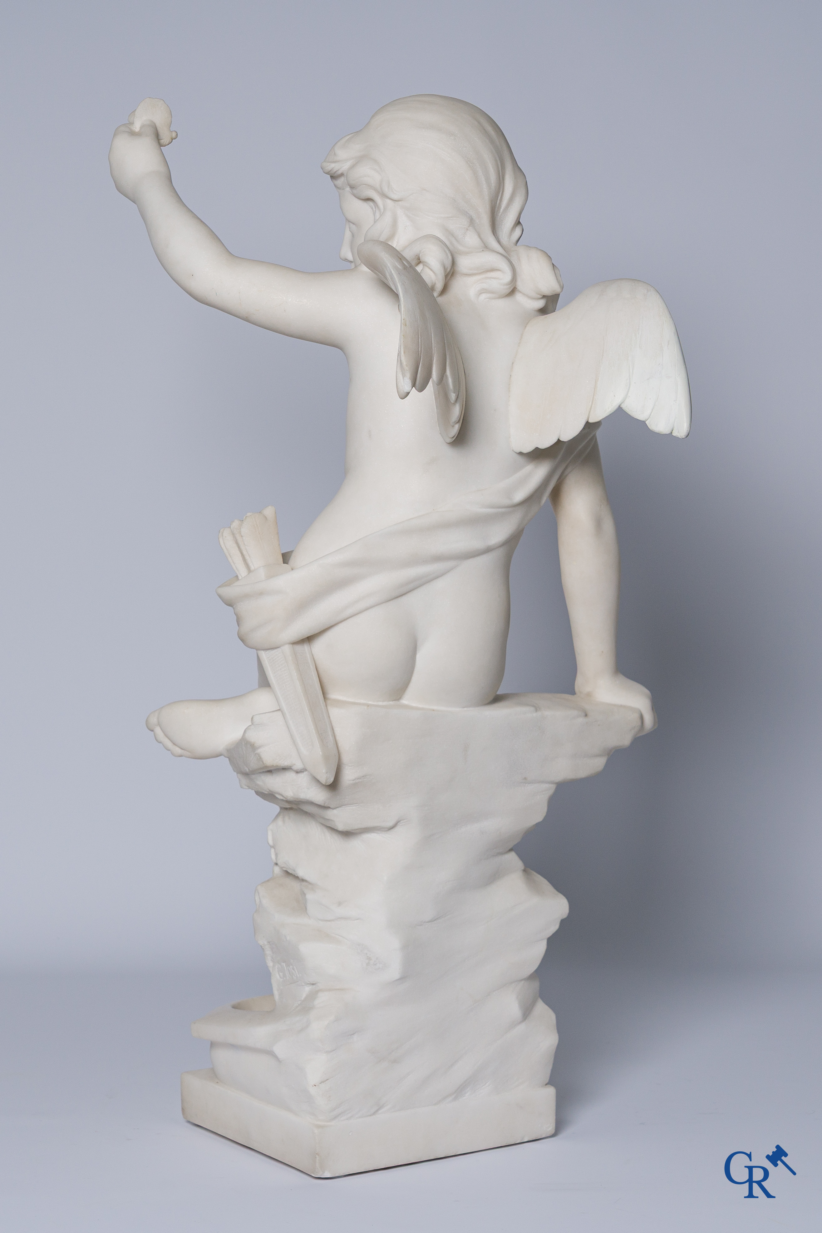 G. Tosi, Beautiful statue in carved marble, seated cupid at wall fountain. Circa 1900.